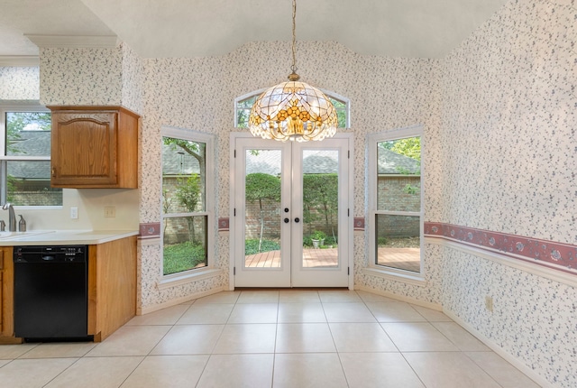 127 S Copperknoll Cir, The Woodlands, TX 77381 - entryway featuring wallpapered walls, a chandelier, french doors, vaulted ceiling, and light tile patterned floors