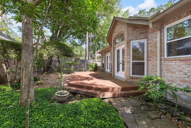 127 S Copperknoll Cir, The Woodlands, TX 77381 - fenced backyard featuring french doors and a deck