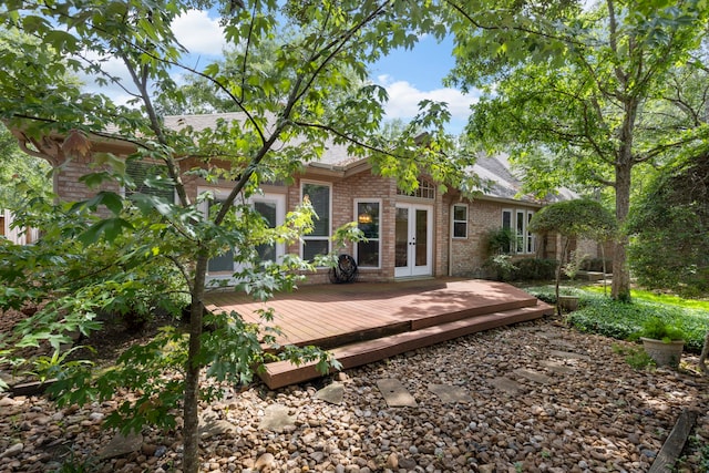 127 S Copperknoll Cir, The Woodlands, TX 77381 - back of property with french doors, a wooden deck, brick siding, and a shingled roof