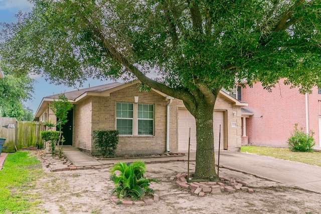 12518 Rosslare Dr, Houston, TX 77066 - view of front of property with an attached garage, brick siding, and driveway