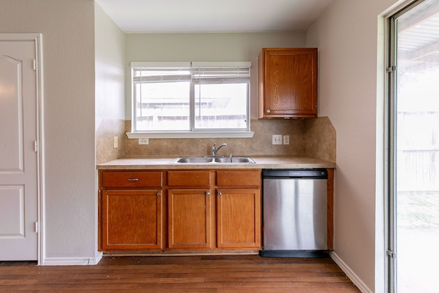 12518 Rosslare Dr, Houston, TX 77066 - kitchen with dishwasher, a sink, light countertops, and brown cabinets