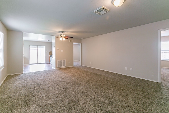 12518 Rosslare Dr, Houston, TX 77066 - carpeted empty room featuring a ceiling fan and baseboards