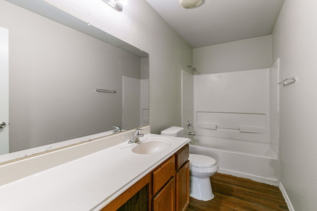 12518 Rosslare Dr, Houston, TX 77066 - full bathroom with toilet, wood finished floors, vanity, bathtub / shower combination, and baseboards