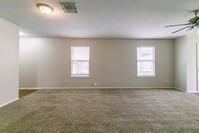 12518 Rosslare Dr, Houston, TX 77066 - spare room with carpet, plenty of natural light, a ceiling fan, and baseboards