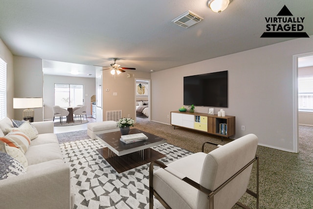 12518 Rosslare Dr, Houston, TX 77066 - living room with carpet, a ceiling fan, and baseboards