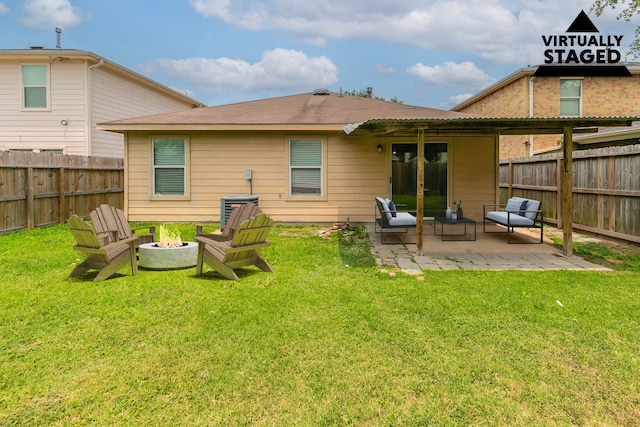 12518 Rosslare Dr, Houston, TX 77066 - back of house with a patio and a fire pit