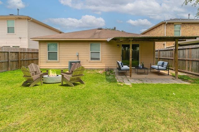 12518 Rosslare Dr, Houston, TX 77066 - rear view of house with a patio area and an outdoor fire pit