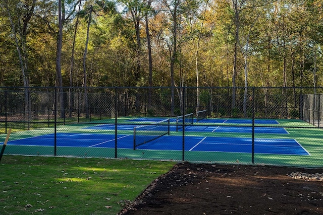 21889 Colorado Bend Ln, Porter, TX 77365 - view of tennis court with a forest view
