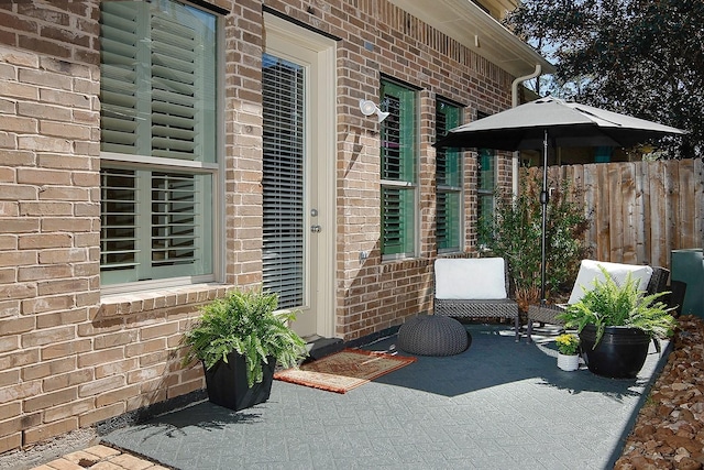 7 Heathcote Ct, The Woodlands, TX 77380 - entrance to property featuring brick siding and a patio area