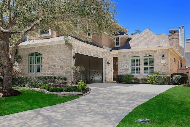 7 Heathcote Ct, The Woodlands, TX 77380 - view of front facade featuring stone siding, driveway, a chimney, a front yard, and an attached garage