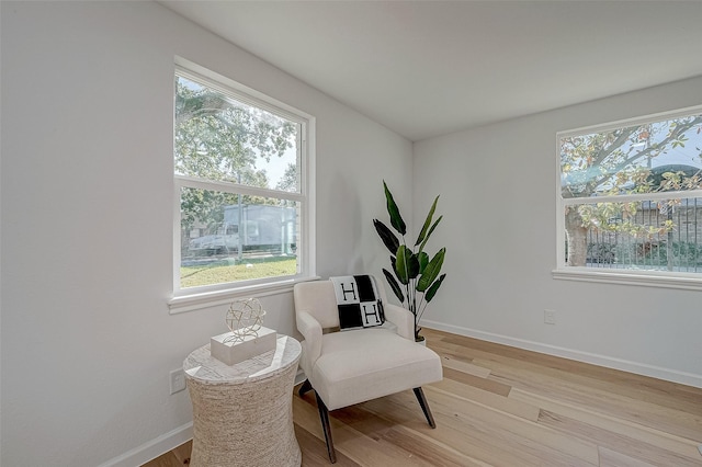 2414 Walnut Bend Ln, Houston, TX 77042 - sitting room featuring plenty of natural light, light wood-style flooring, and baseboards