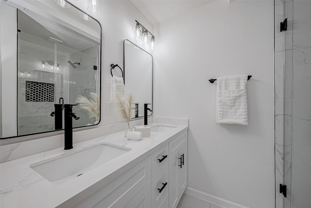 2414 Walnut Bend Ln, Houston, TX 77042 - bathroom featuring double vanity, a marble finish shower, and baseboards