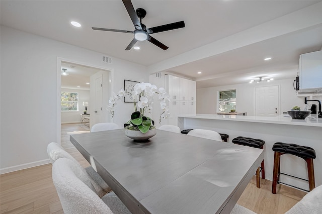 2414 Walnut Bend Ln, Houston, TX 77042 - dining room featuring light wood-type flooring, a ceiling fan, baseboards, and recessed lighting