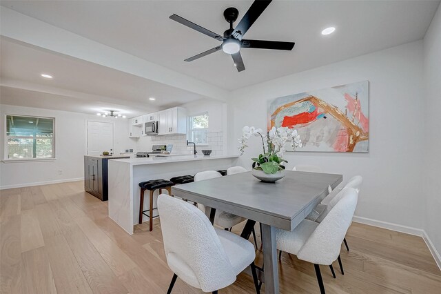 2414 Walnut Bend Ln, Houston, TX 77042 - dining area with light wood-type flooring, baseboards, recessed lighting, and ceiling fan