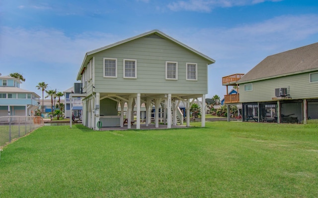 21735 Matagorda Dr, Galveston, TX 77554 - rear view of house with central AC unit