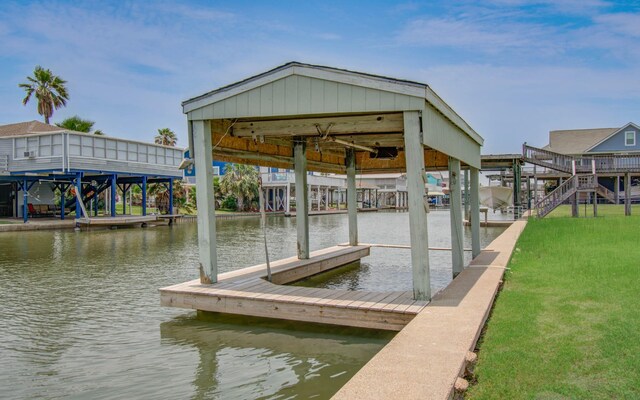 21735 Matagorda Dr, Galveston, TX 77554 - dock featuring a water view and a lawn