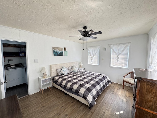 21735 Matagorda Dr, Galveston, TX 77554 - bedroom with a textured ceiling, wood finished floors, washer and dryer, and ceiling fan