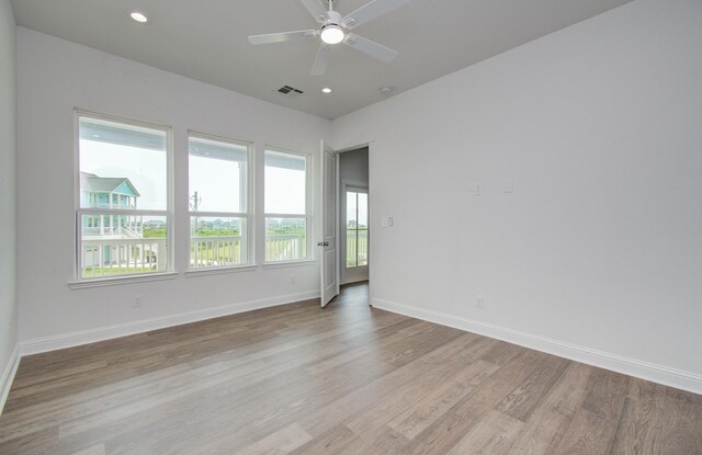 25814 Bay Breeze Dr, Galveston, TX 77554 - unfurnished room featuring light wood-style flooring, ceiling fan, baseboards, and recessed lighting