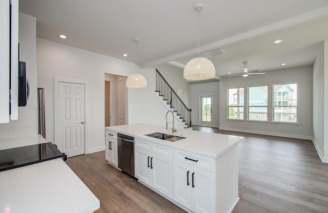 25814 Bay Breeze Dr, Galveston, TX 77554 - kitchen with stainless steel dishwasher, a sink, white cabinetry, wood finished floors, and a ceiling fan