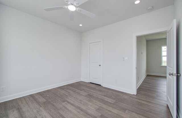 25814 Bay Breeze Dr, Galveston, TX 77554 - empty room featuring wood finished floors, ceiling fan, a smoke detector, recessed lighting, and baseboards