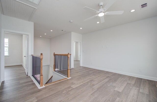 25814 Bay Breeze Dr, Galveston, TX 77554 - unfurnished room featuring attic access, light wood-style floors, recessed lighting, and baseboards
