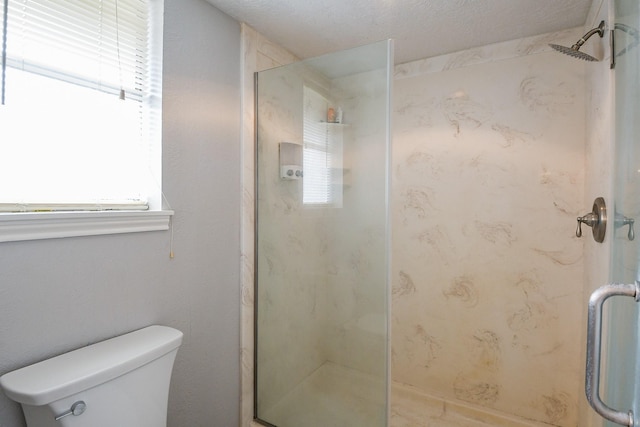 25635 Glen Loch Dr, Spring, TX 77380 - full bathroom featuring a shower stall, plenty of natural light, and toilet