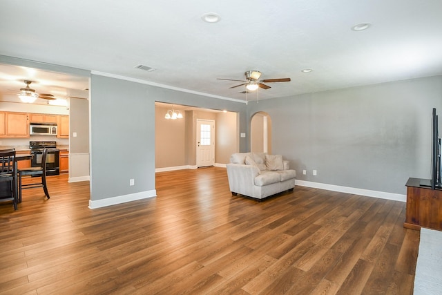 25635 Glen Loch Dr, Spring, TX 77380 - unfurnished living room with ceiling fan, arched walkways, dark wood finished floors, baseboards, and recessed lighting