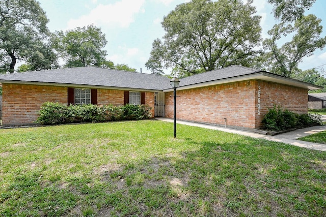 25635 Glen Loch Dr, Spring, TX 77380 - ranch-style home featuring a front lawn and brick siding