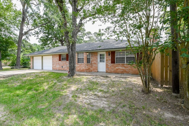 25635 Glen Loch Dr, Spring, TX 77380 - ranch-style house featuring brick siding, an attached garage, and driveway