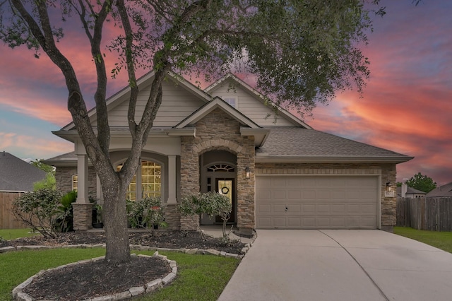 3307 Ellscott Ct, Spring, TX 77386 - view of front of house featuring stone siding, a garage, and concrete driveway
