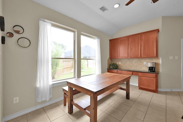 3307 Ellscott Ct, Spring, TX 77386 - dining space featuring ceiling fan, vaulted ceiling, baseboards, light tile patterned flooring, and an office area