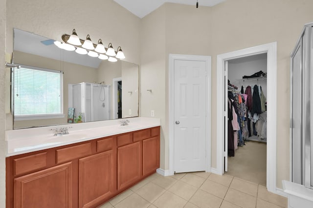 3307 Ellscott Ct, Spring, TX 77386 - full bath with a shower stall, tile patterned floors, double vanity, a walk in closet, and baseboards