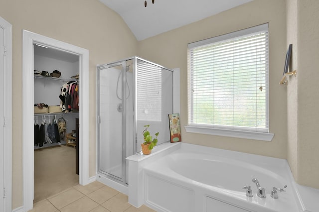 3307 Ellscott Ct, Spring, TX 77386 - bathroom featuring a garden tub, a shower stall, tile patterned flooring, healthy amount of natural light, and vaulted ceiling