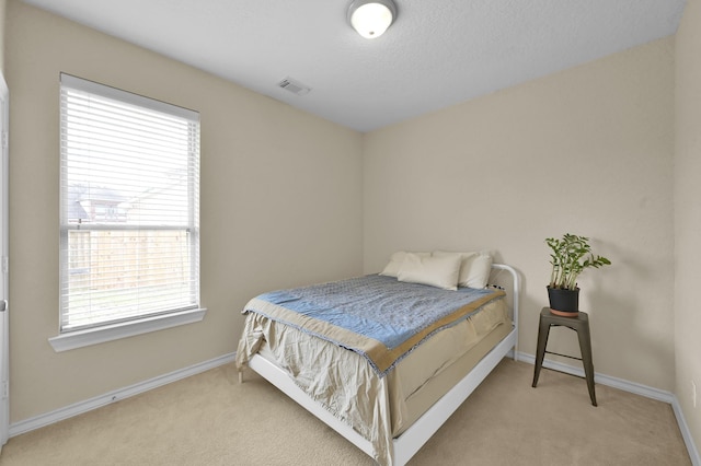 3307 Ellscott Ct, Spring, TX 77386 - bedroom featuring carpet flooring, multiple windows, and baseboards