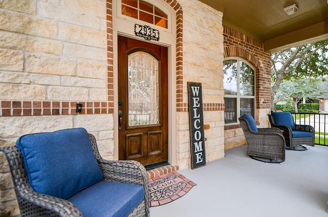 2935 Red Maple Dr, Katy, TX 77494 - doorway to property featuring stone siding and covered porch
