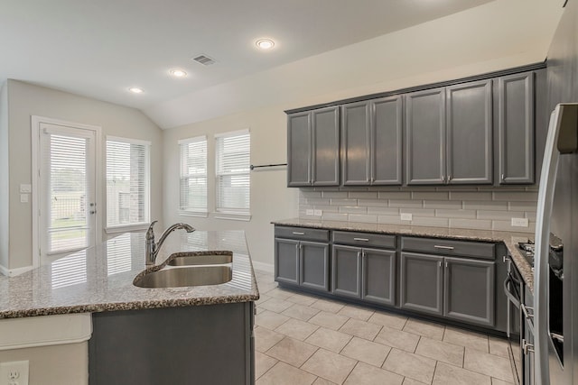 13605 Northline Lake Dr, Houston, TX 77044 - kitchen featuring a sink, gray cabinets, light tile patterned flooring, vaulted ceiling, and recessed lighting