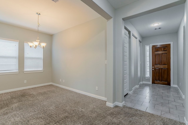 13605 Northline Lake Dr, Houston, TX 77044 - tiled foyer with a chandelier, baseboards, and carpet