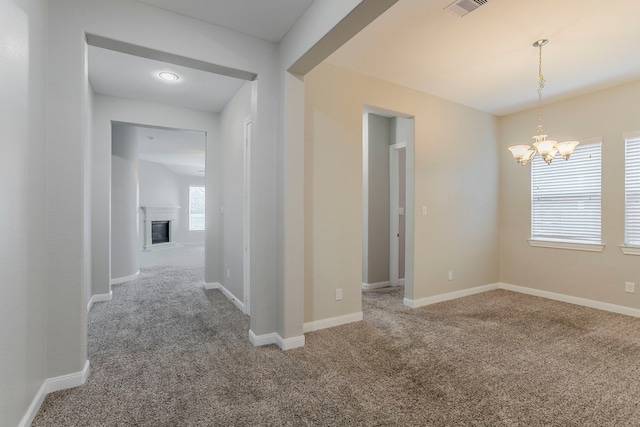13605 Northline Lake Dr, Houston, TX 77044 - hallway featuring carpet flooring, a chandelier, and baseboards