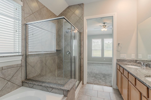 13605 Northline Lake Dr, Houston, TX 77044 - bathroom with ceiling fan, a shower stall, tile patterned floors, and double vanity