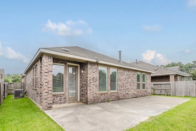 13605 Northline Lake Dr, Houston, TX 77044 - back of property featuring a patio area, brick siding, and central AC