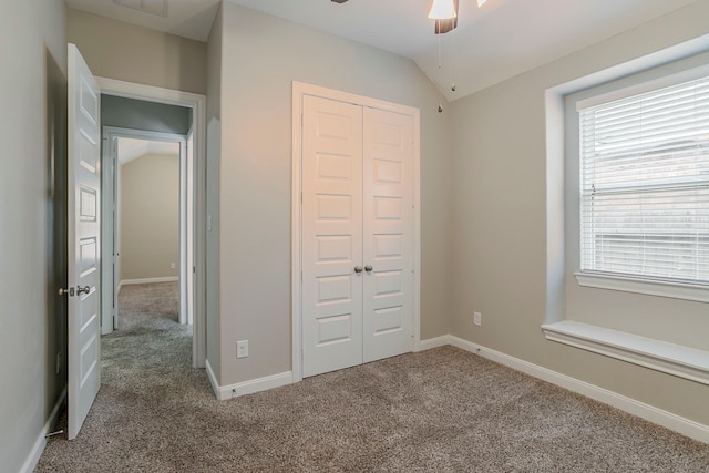 13605 Northline Lake Dr, Houston, TX 77044 - unfurnished bedroom featuring a closet, carpet, lofted ceiling, and baseboards