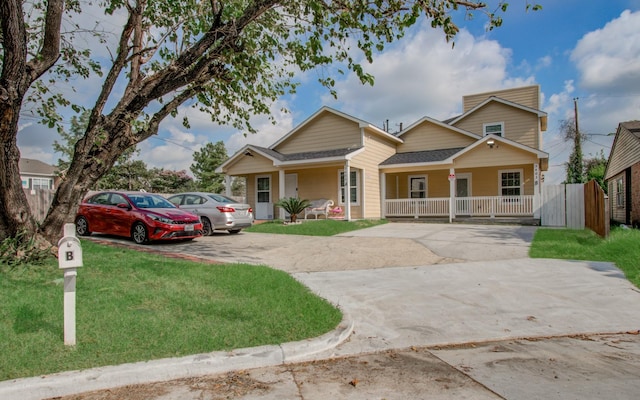 5403 Farley Dr, Houston, TX 77032 - view of front of home with a porch, concrete driveway, a front yard, and a shingled roof