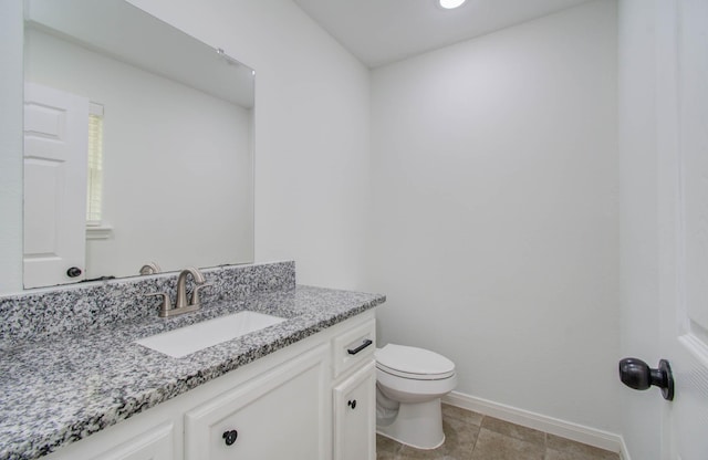 5403 Farley Dr, Houston, TX 77032 - half bathroom with toilet, vanity, baseboards, and tile patterned flooring