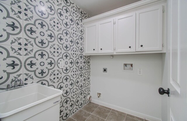 5403 Farley Dr, Houston, TX 77032 - laundry area with washer hookup, baseboards, cabinet space, tile patterned floors, and hookup for an electric dryer