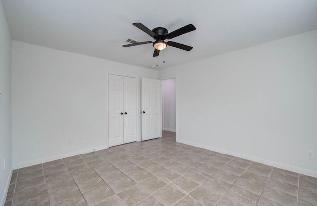 5403 Farley Dr, Houston, TX 77032 - unfurnished bedroom with a closet, baseboards, and light tile patterned floors