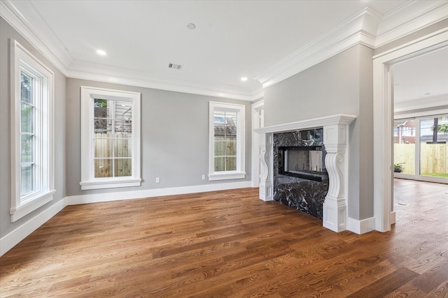 2216 Tangley St, Houston, TX 77005 - unfurnished living room featuring wood finished floors, ornamental molding, a high end fireplace, and baseboards
