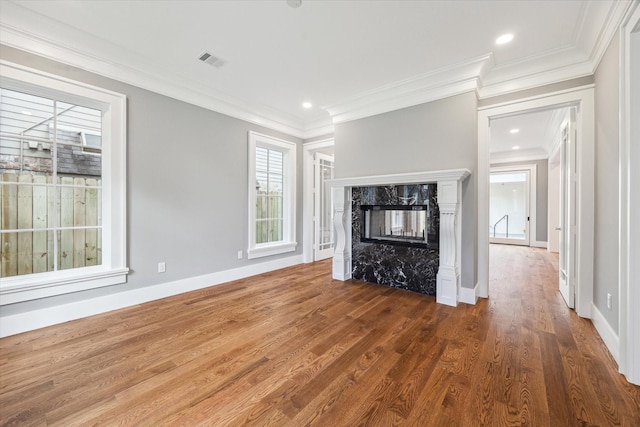2216 Tangley St, Houston, TX 77005 - unfurnished living room with wood finished floors, ornamental molding, a premium fireplace, baseboards, and recessed lighting