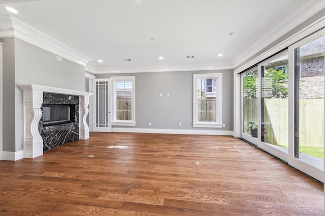 2216 Tangley St, Houston, TX 77005 - unfurnished living room with healthy amount of natural light, crown molding, wood finished floors, a high end fireplace, and recessed lighting