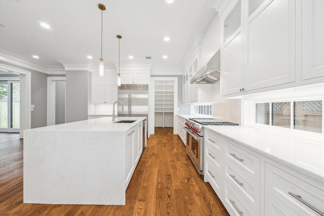 2216 Tangley St, Houston, TX 77005 - kitchen featuring high quality appliances, a sink, glass insert cabinets, a center island with sink, and dark wood finished floors