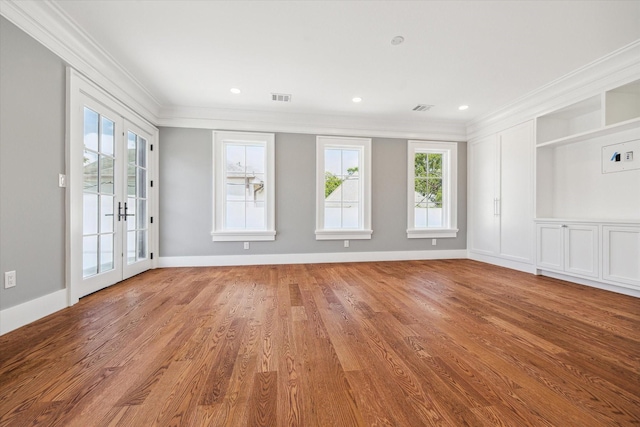 2216 Tangley St, Houston, TX 77005 - empty room with ornamental molding, healthy amount of natural light, wood finished floors, and baseboards
